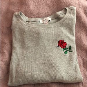 Embroidered rose crew neck